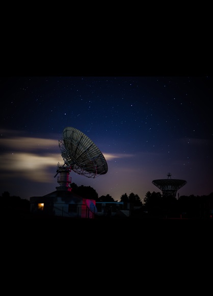 satellite dish under a starry sky