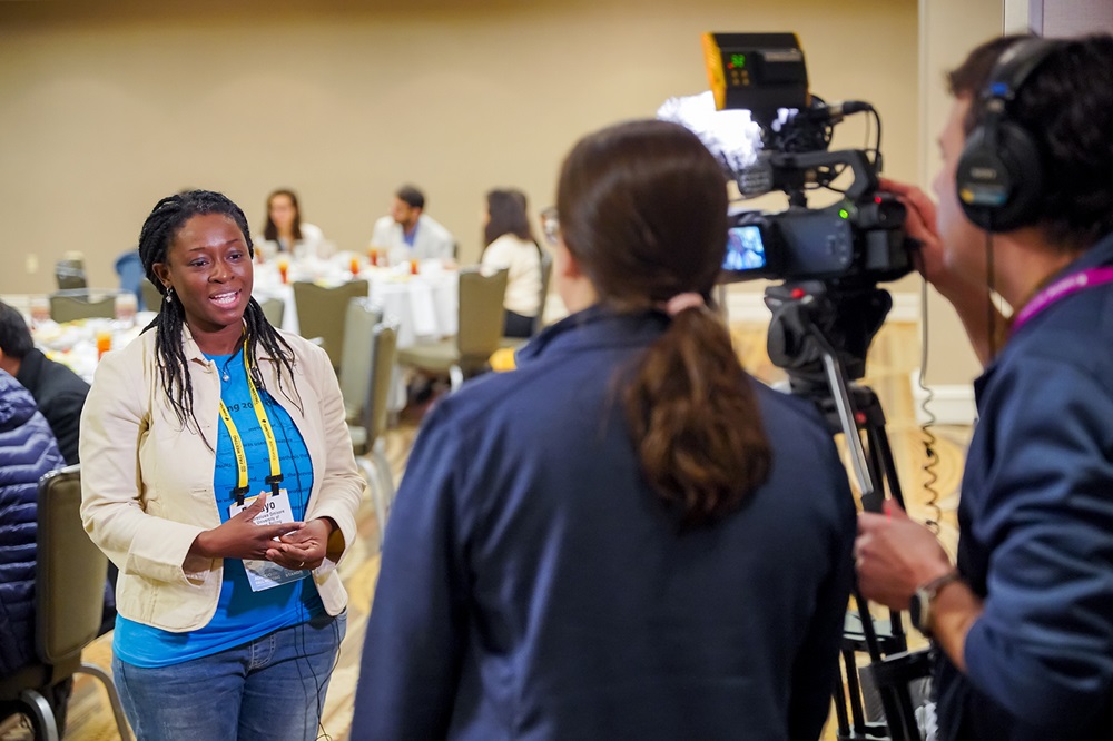 A woman is interviewed by video