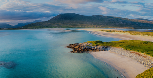 Blue ocean and beaches off Scotland's coast on a sunny day